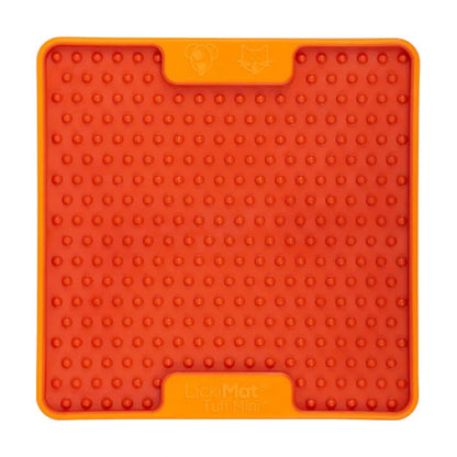 Orange LickiMat Mini TUFF Soother with soft nubs texture for runnier treats like yogurt, broth, puree and wet food, calming enrichment lick mat that slows feeding for dogs and cats.