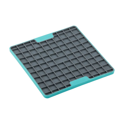 Angled view of turquoise LickiMat Playdate TUFF enrichment mat with square texture