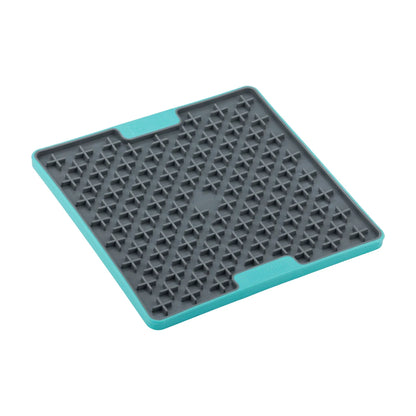 Angled view of the LickiMat TUFF Buddy Turquoise lick mat showing the textured cross pattern for slow feeding