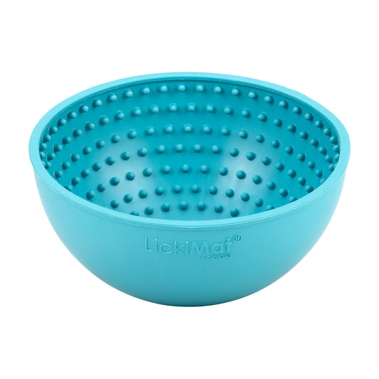 Angled view of turquoise LickiMat Wobble slow feeder bowl for dogs showing how deep.