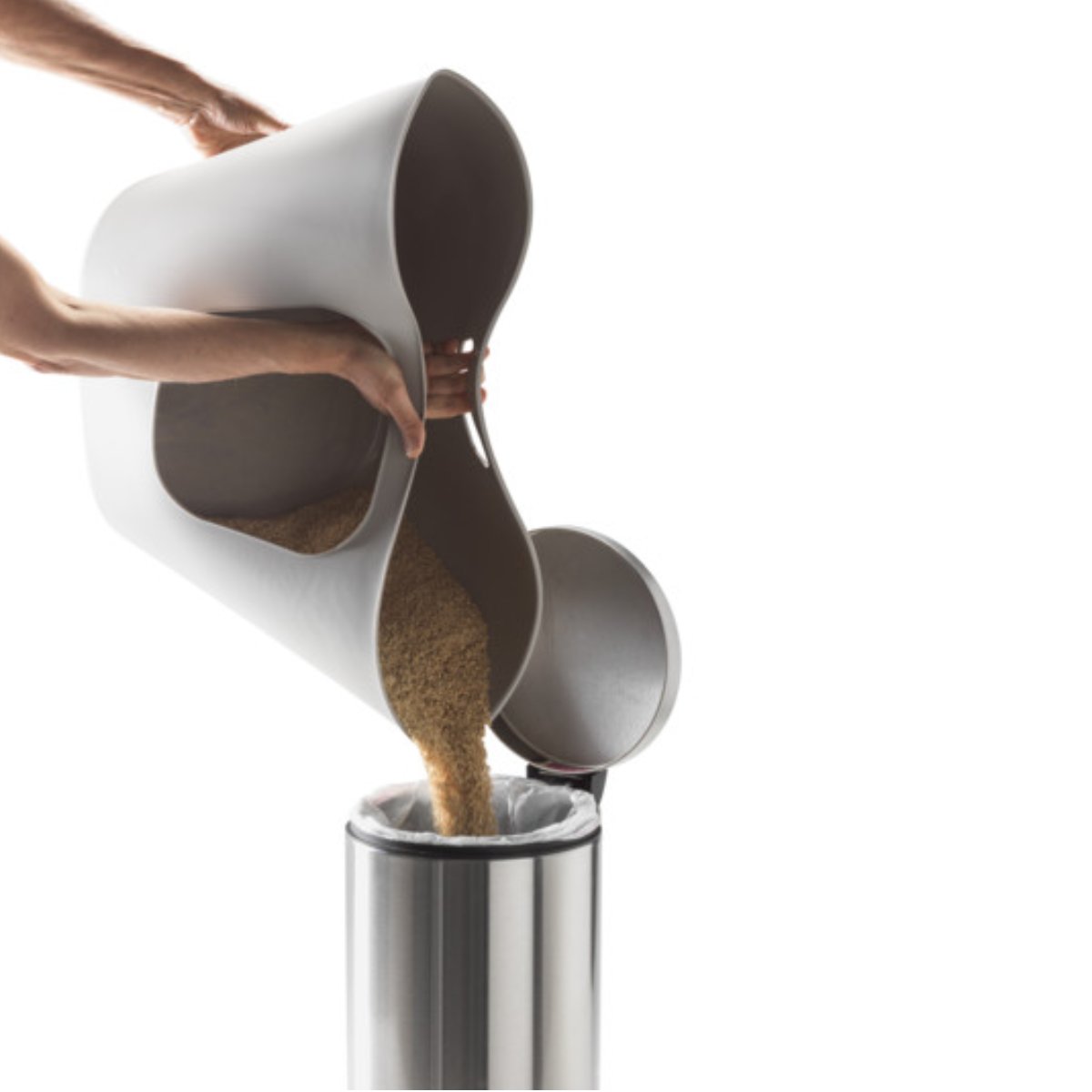 Moderna Lotus flexible litter tray being used to pour out cat litter