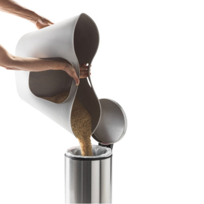 Moderna Lotus flexible litter tray being used to pour out cat litter