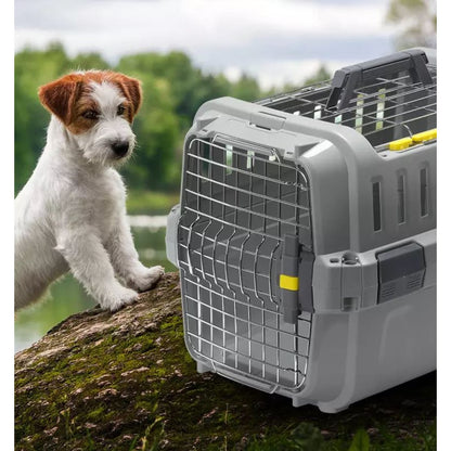 Dog beside the Moderna Odyssey Pet Carrier in Olive Green