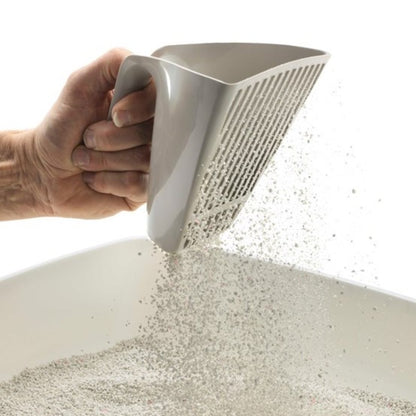 Moderna Scoop & Sift cat litter scoop sifting litter through the V-shaped blades