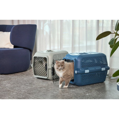 Cat beside Moderna Ventura pet carriers in Copen Blue and Olive Green