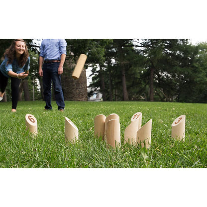 Players enjoying the Mölkky Original outdoor throwing game on grass