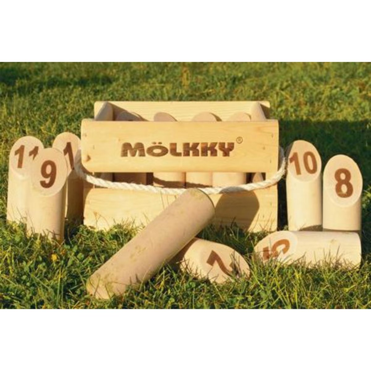 Mölkky Original wooden game crate with numbered pins arranged on grass