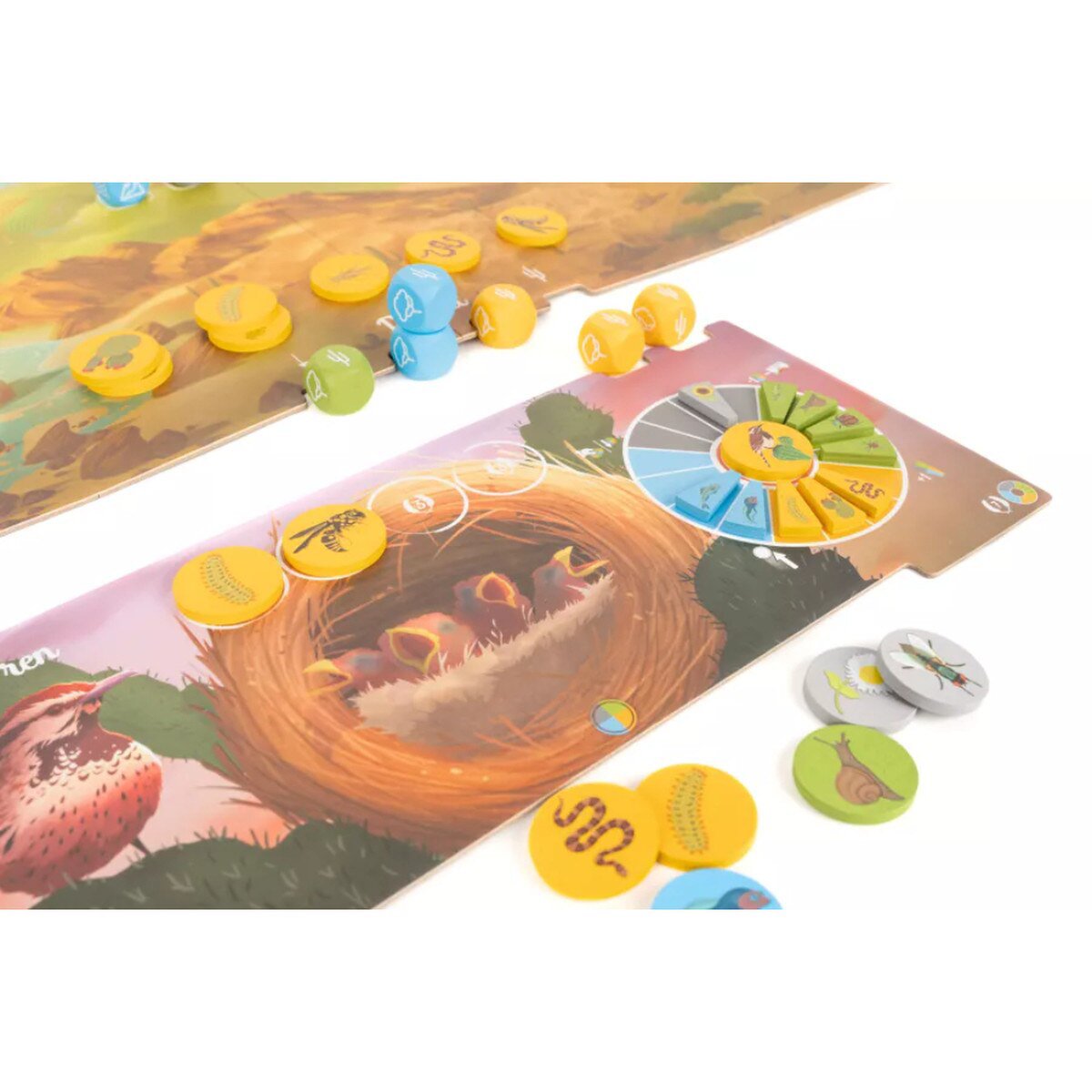 Nestlings board game close up showing nestling board, colourful resource tokens and scoring wheel