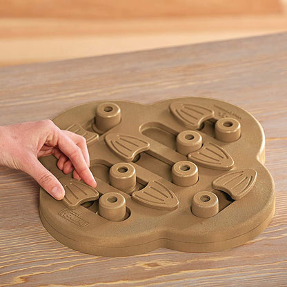 Hand sliding pieces on Nina Ottosson Hide n Slide composite puzzle toy for dogs