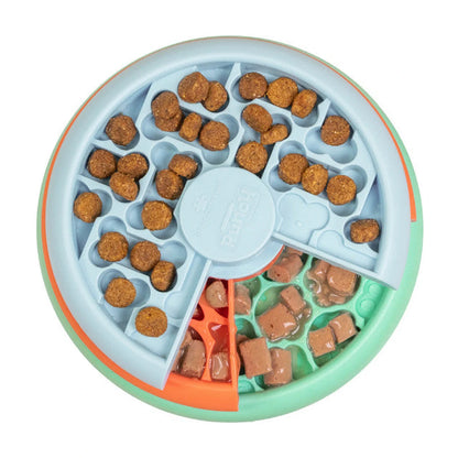 Nina Ottosson Puppy Lickin' Layers dog puzzle feeder filled with kibble and treats for puppies and small dogs