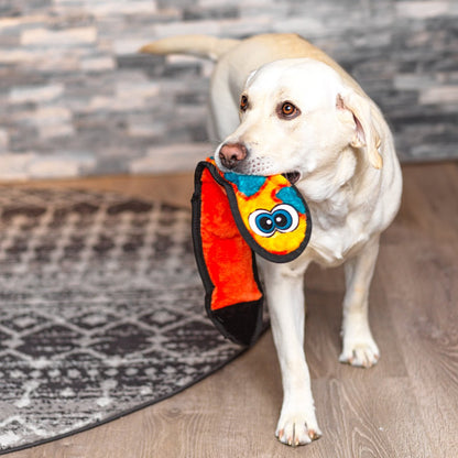 Dog carrying orange Outward Hound Durablez Snake Plush Dog Toy Large