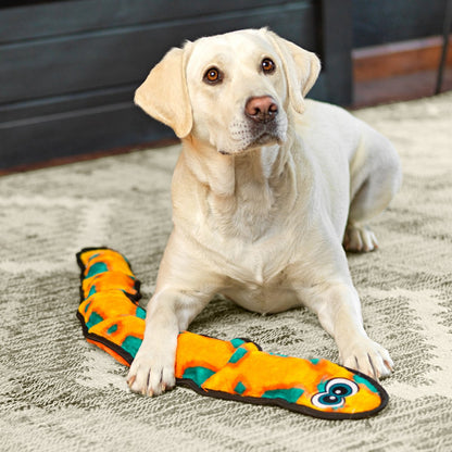 Labrador with Outward Hound Durablez Snake X Large Orange plush dog toy during indoor play