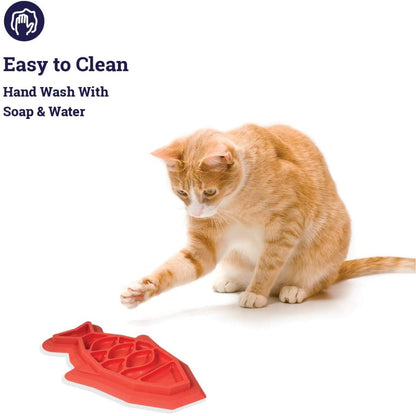 Cat with Outward Hound Fishie Fun Feed Mat showing easy-clean design