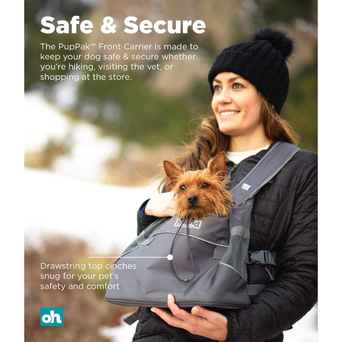 Small dog riding in an Outward Hound PupPak grey front carrier during an outdoor outing