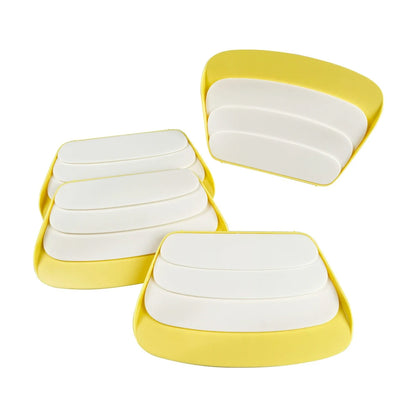 Yellow and white playing card stands showing the tiered card holder design