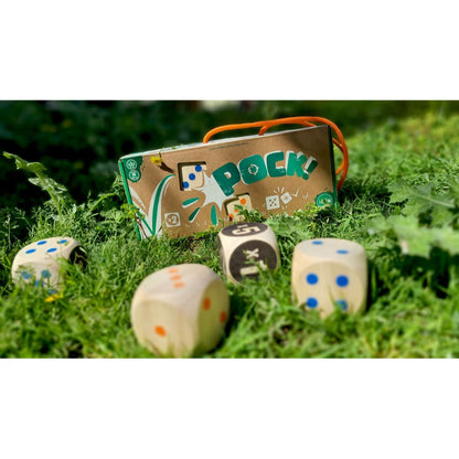Pock! outdoor dice game with dice set up on grass