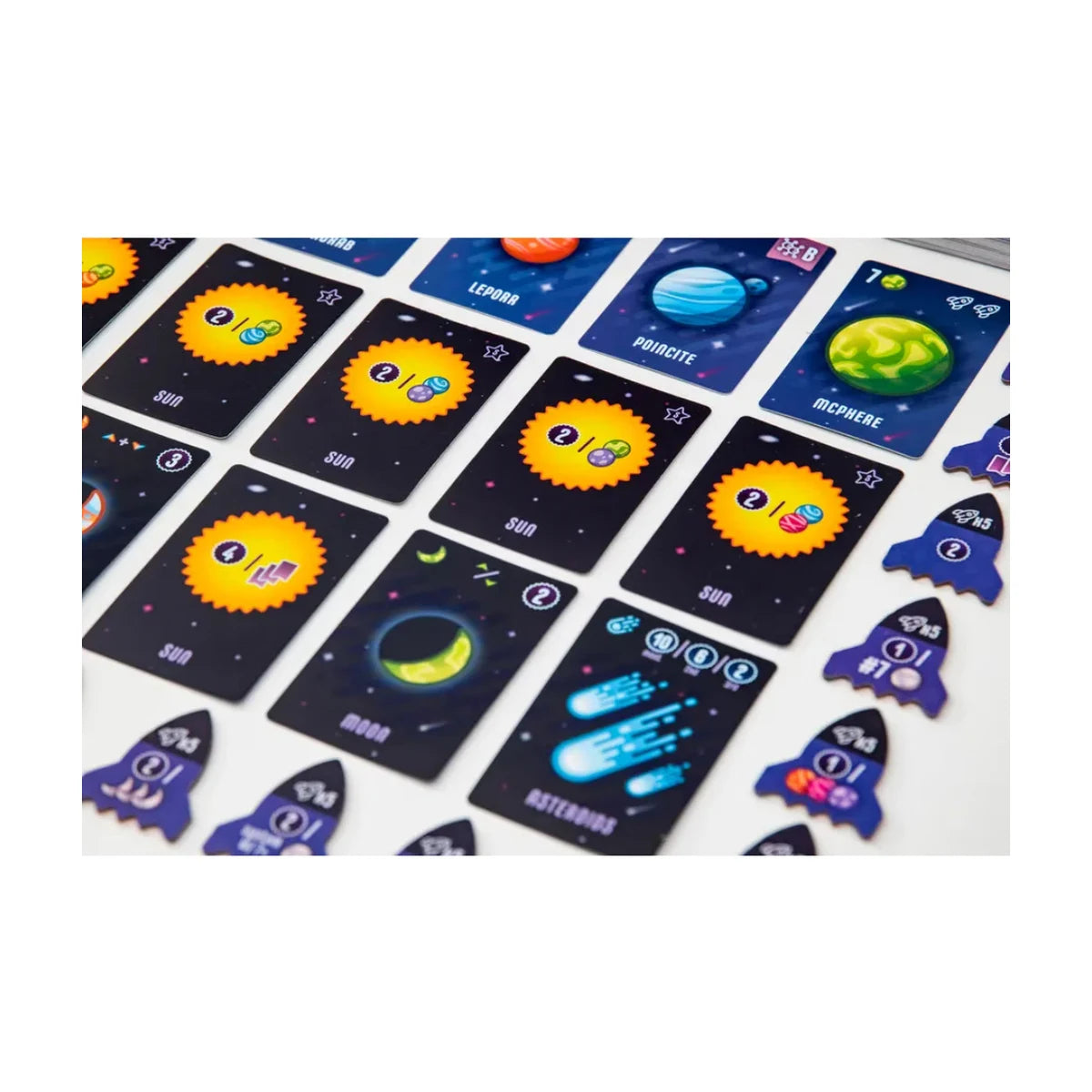 Point Galaxy card game with planet cards, space cards, and rocket scoring tokens