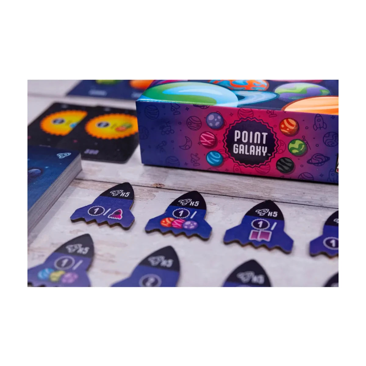 Point Galaxy card game close-up with rocket tokens, card deck, and colourful box detail