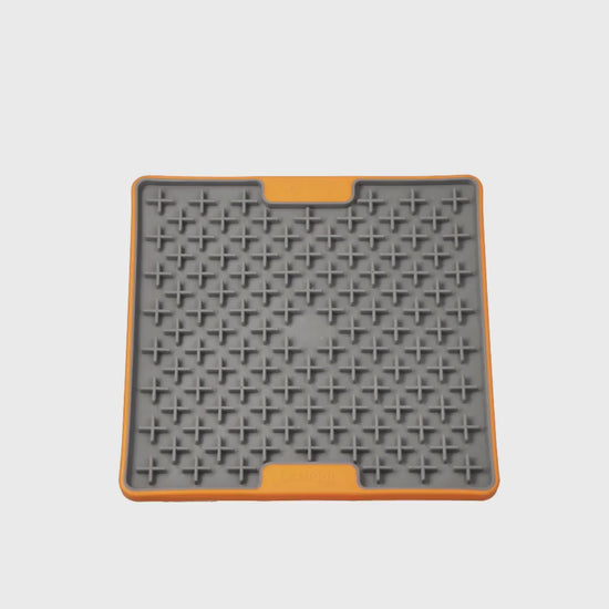Video showing the LickiMat TUFF Buddy Orange slow feeder lick mat for dogs and cats on a white background