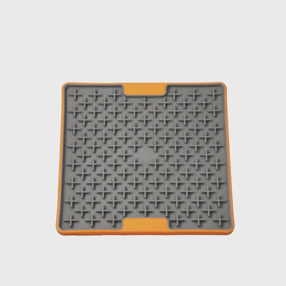 Video showing the LickiMat TUFF Buddy Orange slow feeder lick mat for dogs and cats on a white background
