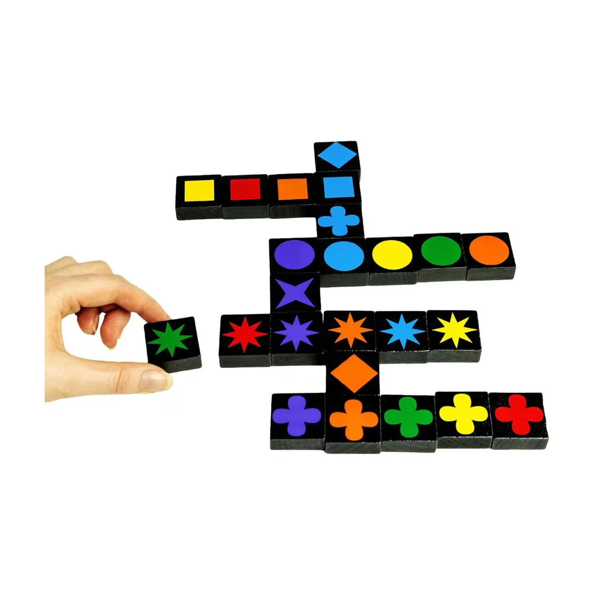 Qwirkle gameplay closeup with hand placing a tile