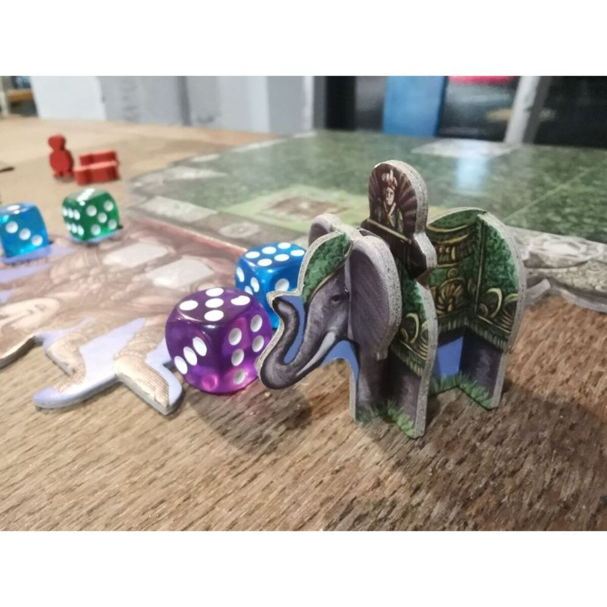 Rajas of the Ganges board game starting player elephant with colourful dice during gameplay