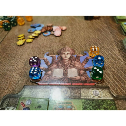 Rajas of the Ganges Kali board holding colourful dice beside the player province board