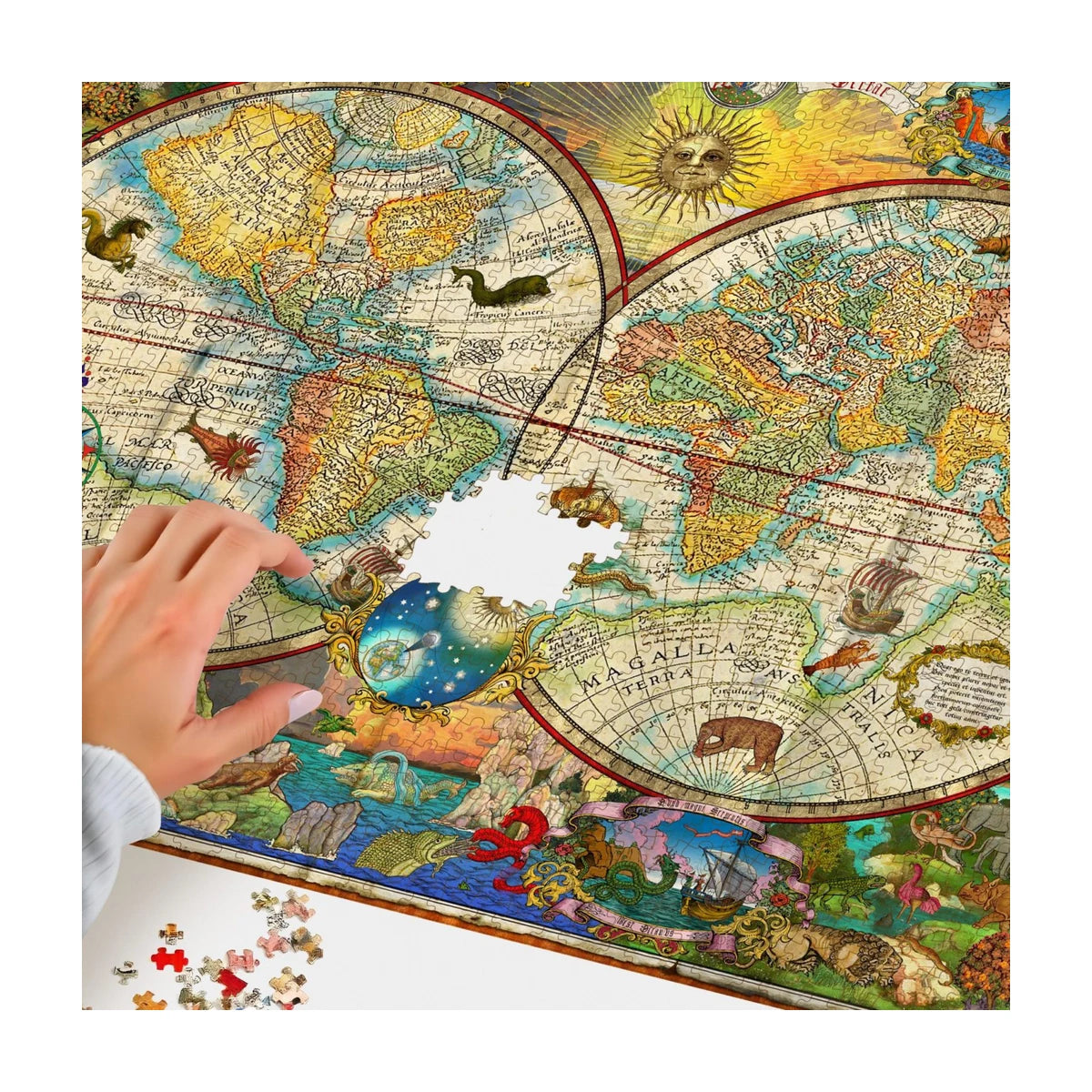 Hands building RGS Map of the World 1000 piece jigsaw puzzle showing detailed vintage map sections