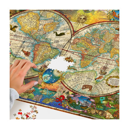 Hands building RGS Map of the World 1000 piece jigsaw puzzle showing detailed vintage map sections
