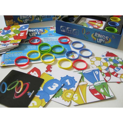 Rings Up game open box with colourful rings, challenge cards and rules for family dexterity party gameplay