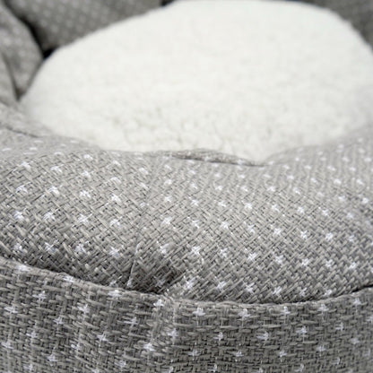Close-up of the grey dotted fabric and white fleece centre of the Rosewood Dotty Feline Cat Bed