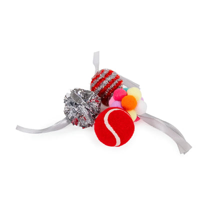 Close-up of four assorted cat toys from the Rosewood Festive Ball Gift Box, including a red ball, multicoloured pom-pom ball, silver crinkle ball and red striped tinsel ball.