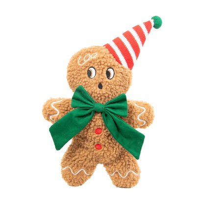 Rosewood George Gingerbread Man Christmas plush squeaky dog toy with brown bouclé body, large green bow and red-and-white striped festive hat on white background.