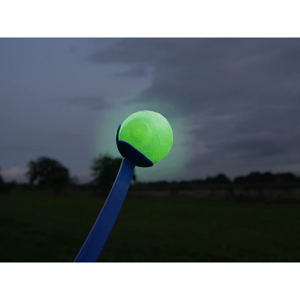 Rosewood Glow in the Dark Ball glowing during low-light play