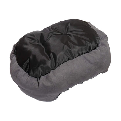 Underside view of the Rosewood Grey Lion Faux Suede Oval Dog Bed's black fabric cushion, surrounded by the grey faux suede padded sides.