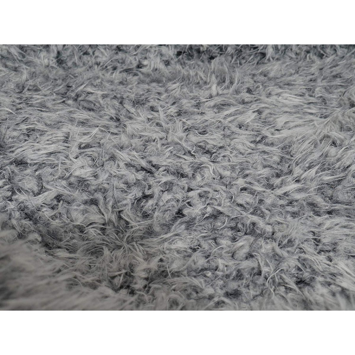 Close-up of the soft, shaggy grey lion-style faux fur lining inside the Rosewood Grey Lion Faux Suede Oval Dog Bed.