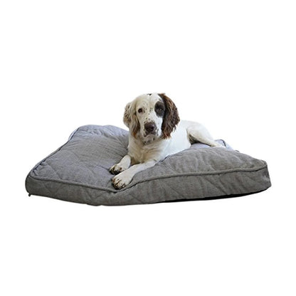 White and brown spaniel resting on the Rosewood Grey Tweed Mattress, showing its thick cushioning and spacious rectangular sleeping surface.