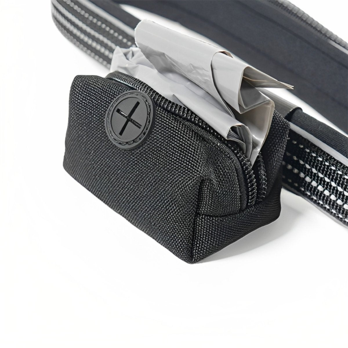 Close-up of the zipped poop-bag holder attached to the Rosewood Reflective Dog Lead, showing waste bags, the dispensing opening and reflective nylon straps.