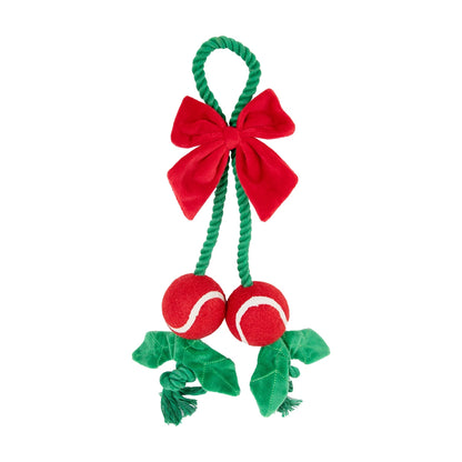 Rosewood Holly Jolly Christmas rope dog toy with green rope loop, red plush bow, two red balls and green fabric details on white background.