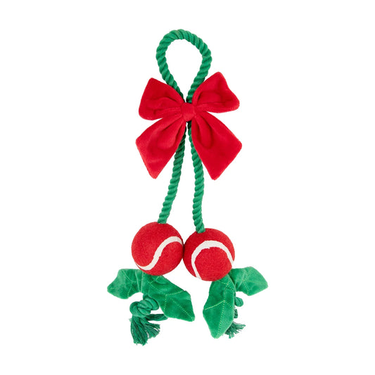 Rosewood Holly Jolly Christmas rope dog toy with green rope loop, red plush bow, two red balls and green fabric details on white background.