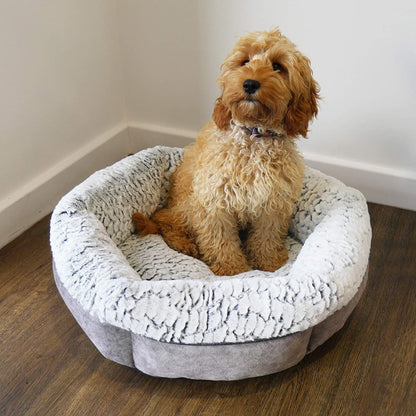Fluffy tan dog sitting comfortably inside the Rosewood Luxury Fleece Lined Plush Bed with deep padded sides and soft grey and white fleece lining.