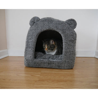 Cat resting inside the grey Rosewood Luxury Teddy Bear Cat Cave Bed in a home setting