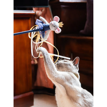 Siamese-style cat batting at the flowing ribbons beneath the Rosewood Marie Mouse ballerina cat teaser wand during interactive indoor play.
