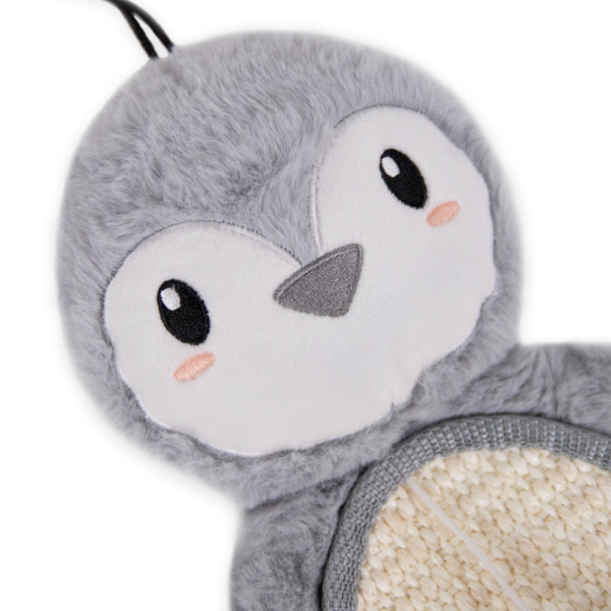 Close-up of the Rosewood Mr Poppy Penguin cat scratcher showing its soft grey plush face, embroidered eyes, triangular beak and textured scratching pad.