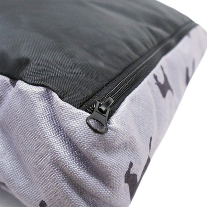 Close-up of the zipper on the removable cover of the Rosewood Padded Dog Print Grey Mattress, showing the black underside and grey canvas.
