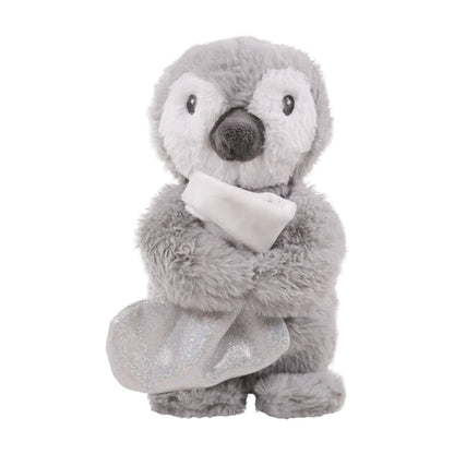 Rosewood Prancer Penguin grey and white plush Christmas dog toy holding a sparkly silver treat-hiding stocking.