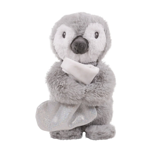Rosewood Prancer Penguin grey and white plush Christmas dog toy holding a sparkly silver treat-hiding stocking.