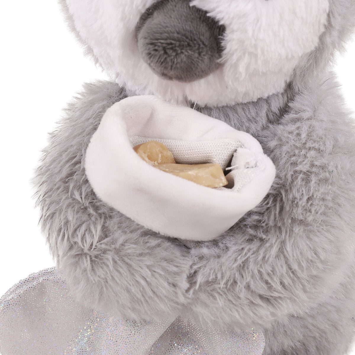 Close-up of Rosewood Prancer Penguin's white treat-hiding stocking pocket containing dog treats, with fluffy grey plush body visible.