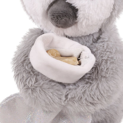 Close-up of Rosewood Prancer Penguin's white treat-hiding stocking pocket containing dog treats, with fluffy grey plush body visible.