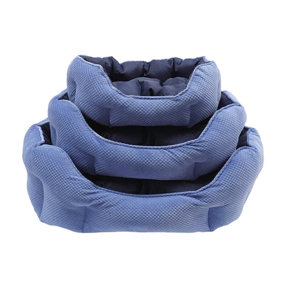 Three Rosewood Quilted Navy Water-Resistant Dog Beds stacked to show the Small, Medium and Large sizes with padded navy interiors.